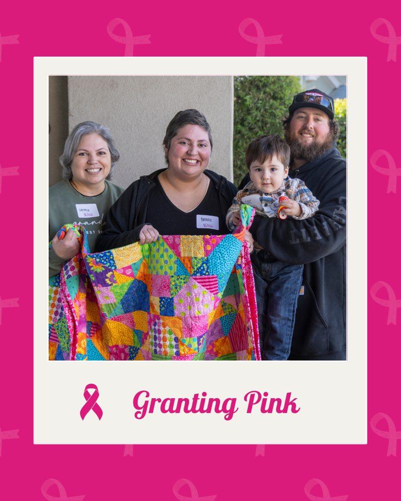 Granting Pink: a family holding a bright quilt